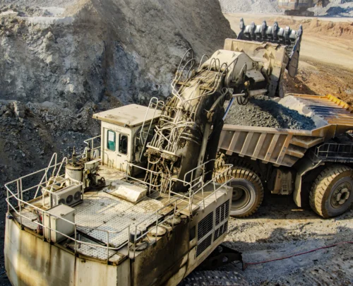 excavator-loading-big-dump-truck-in-open-pit-2025-02-21-19-56-35-utc