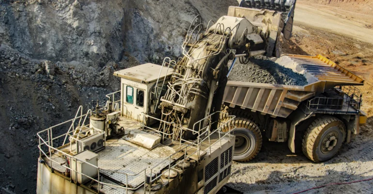 excavator-loading-big-dump-truck-in-open-pit-2025-02-21-19-56-35-utc